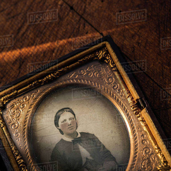 Studio shot of old fashioned photograph in picture frame Stock Photo Dissolve