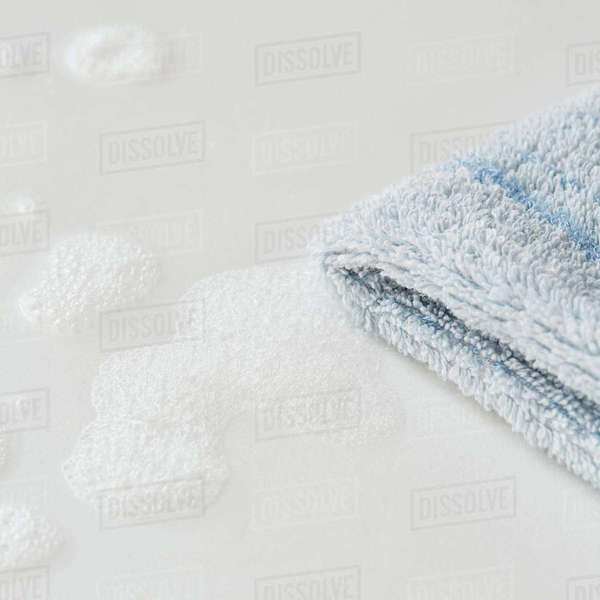 Dish towel and soap suds Stock Photo Dissolve