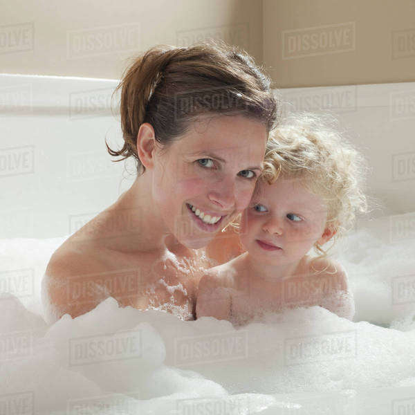 Mother and child having bubble bath Stock Photo Dissolve