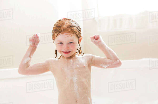 Smiling girl (4-5) having bubble bath - Royalty-free Stock Photo | Dissolve