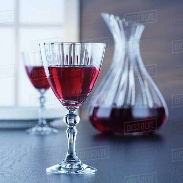 A carafe and glasses of red wine Stock Photo Dissolve