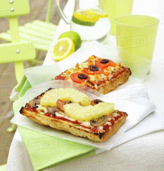 Two different focaccia pizzas Stock Photo Dissolve