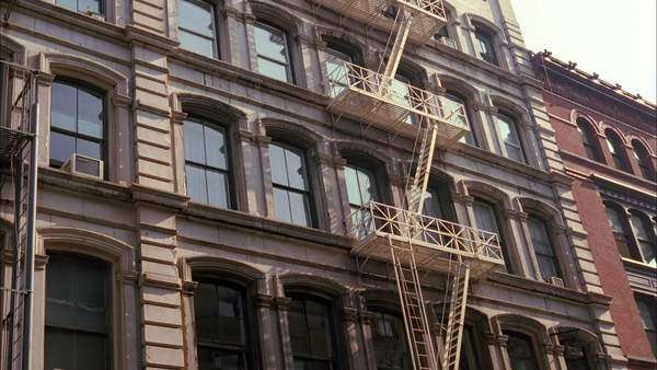 Static Shot Of An Apartment Building With Fire Escape In New York Static Shot Of An Apartment Building With Fire Escape In New York City
