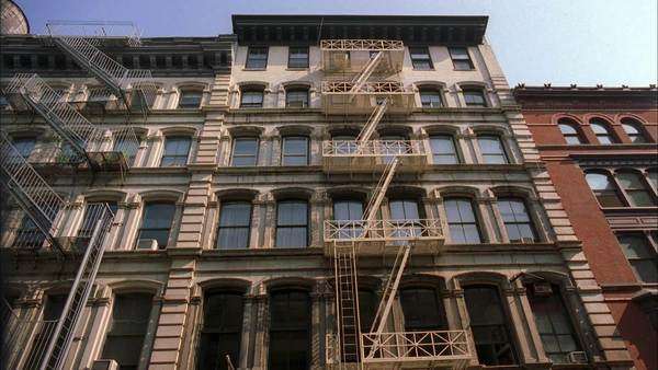 Low Angle Shot Of An Apartment Building With Fire Escape In New York Low Angle Shot Of An Apartment Building With Fire Escape In New York City