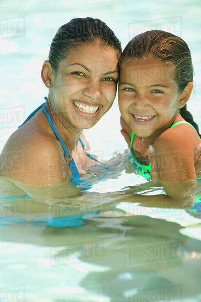 Portrait of mother and daughter swimming - Stock Photo - Dissolve
