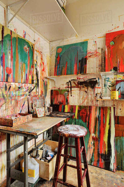 Paint splattered walls of art studio - Stock Photo - Dissolve