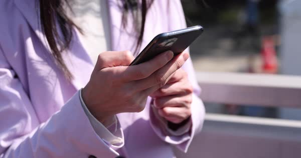 Body parts of hands using smartphne by Japanese woman at the street ...