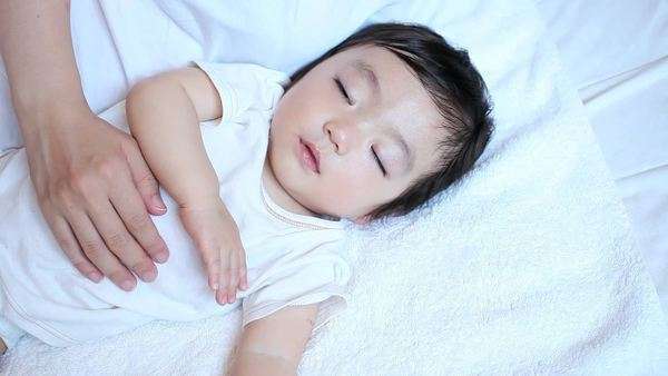 A Sleeping Japanese Boy And A Hand Of His Mom Stock Video Footage