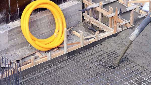 Pouring Concrete Mix From Cement Mixer On Concreting Formwork