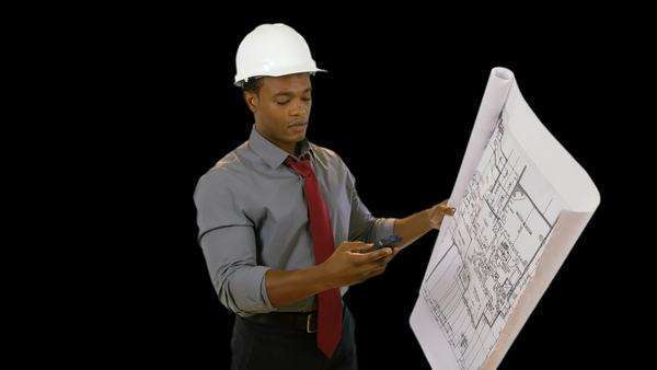 What It Takes To Be An Architect an architect holding a set of plans takes a call on his cell phone What It Takes To Be An Architect an architect holding a set of plans takes a call on his cell phone