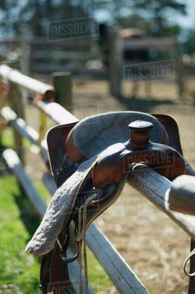 A Saddle On A Fence - Stock Photo - Dissolve