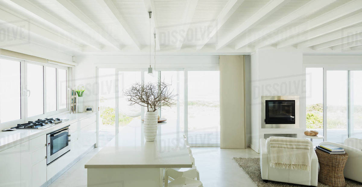 White Kitchen With Wood Beam Ceilings In Home Showcase Interior