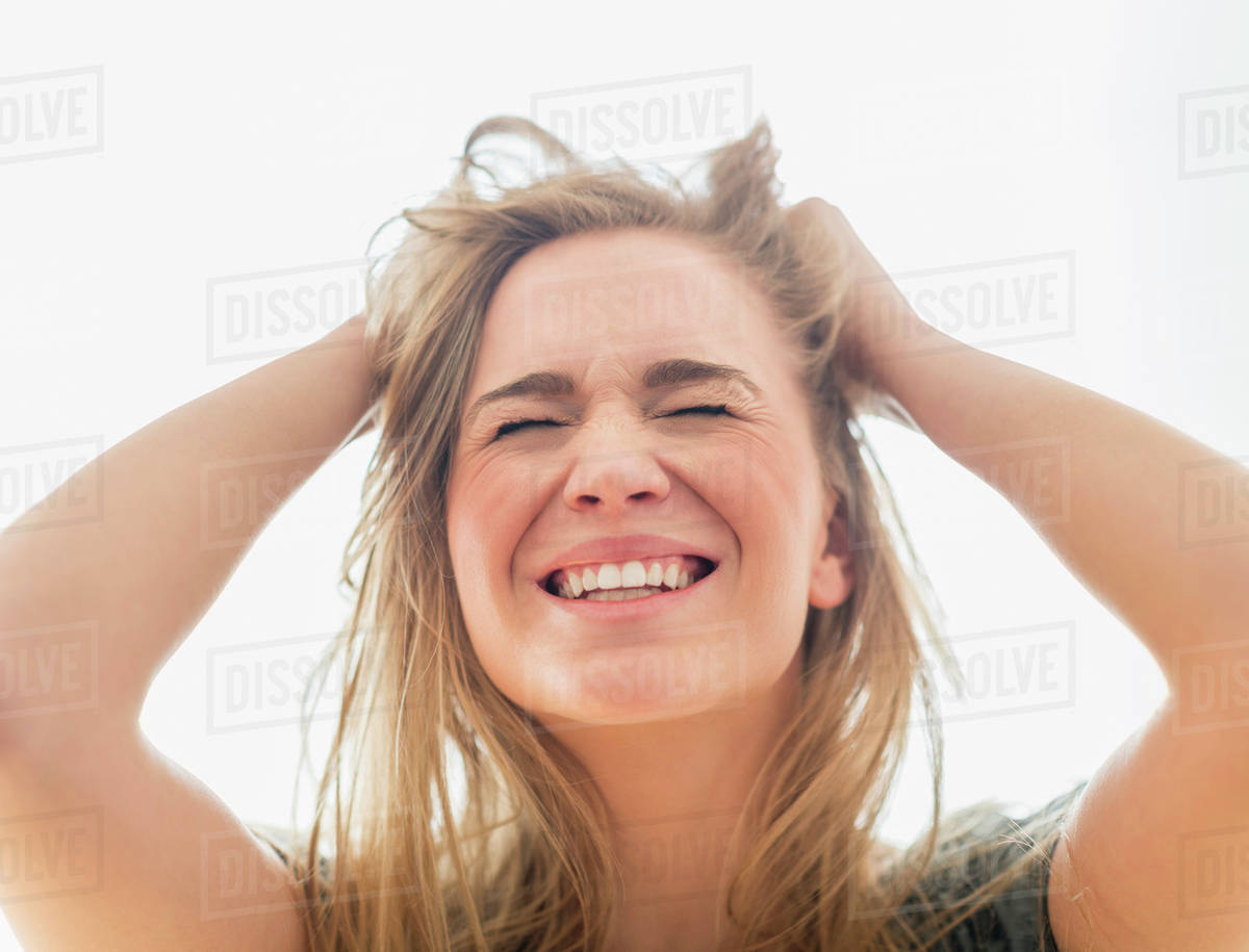 Frustrated woman pulling hair Stock Photo Dissolve