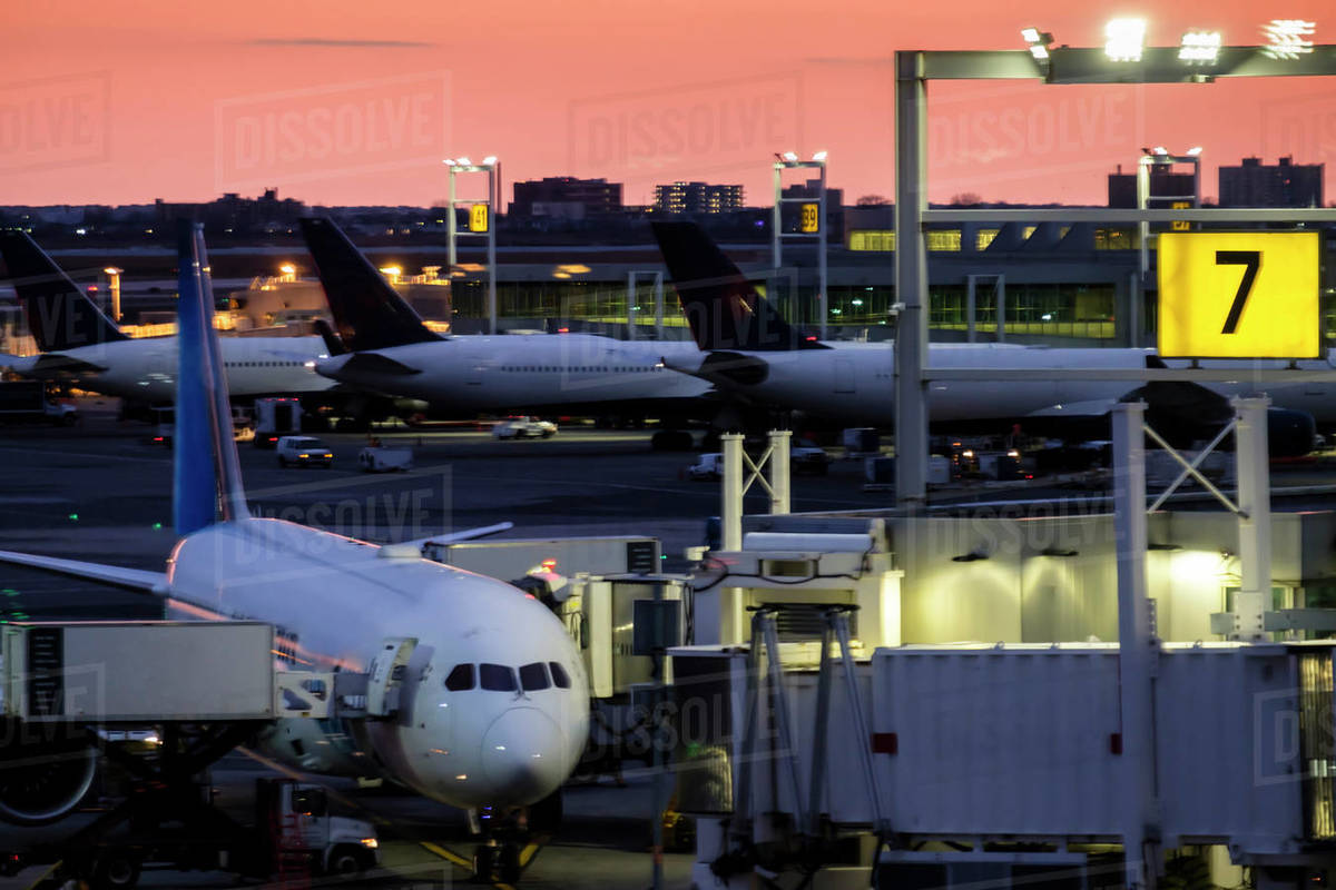 Airplane at airport terminal Stock Photo Dissolve