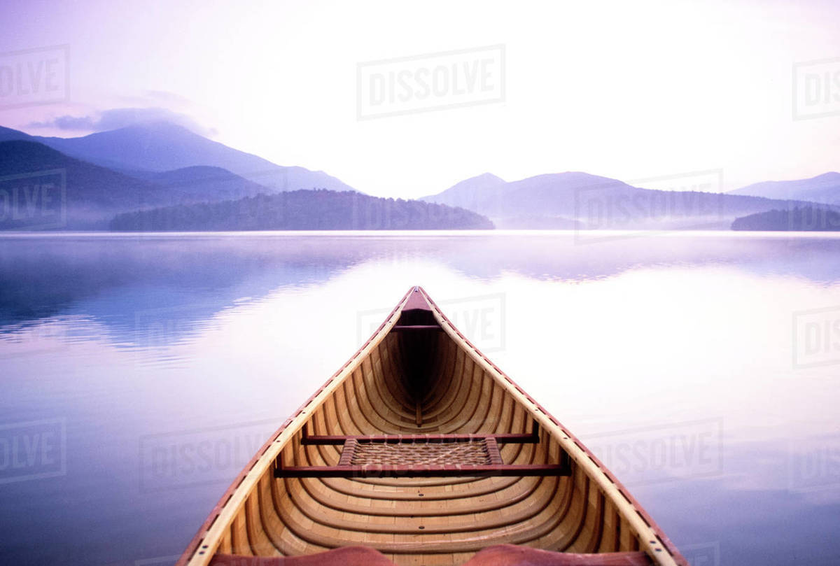 United States, New York, Lake Placid, View of Whiteface Mountain from wooden canoe on Lake