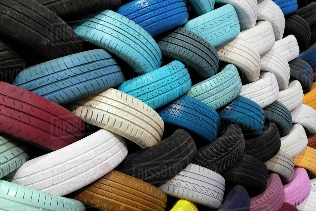 Wall of colorful recycled tires Stock Photo Dissolve