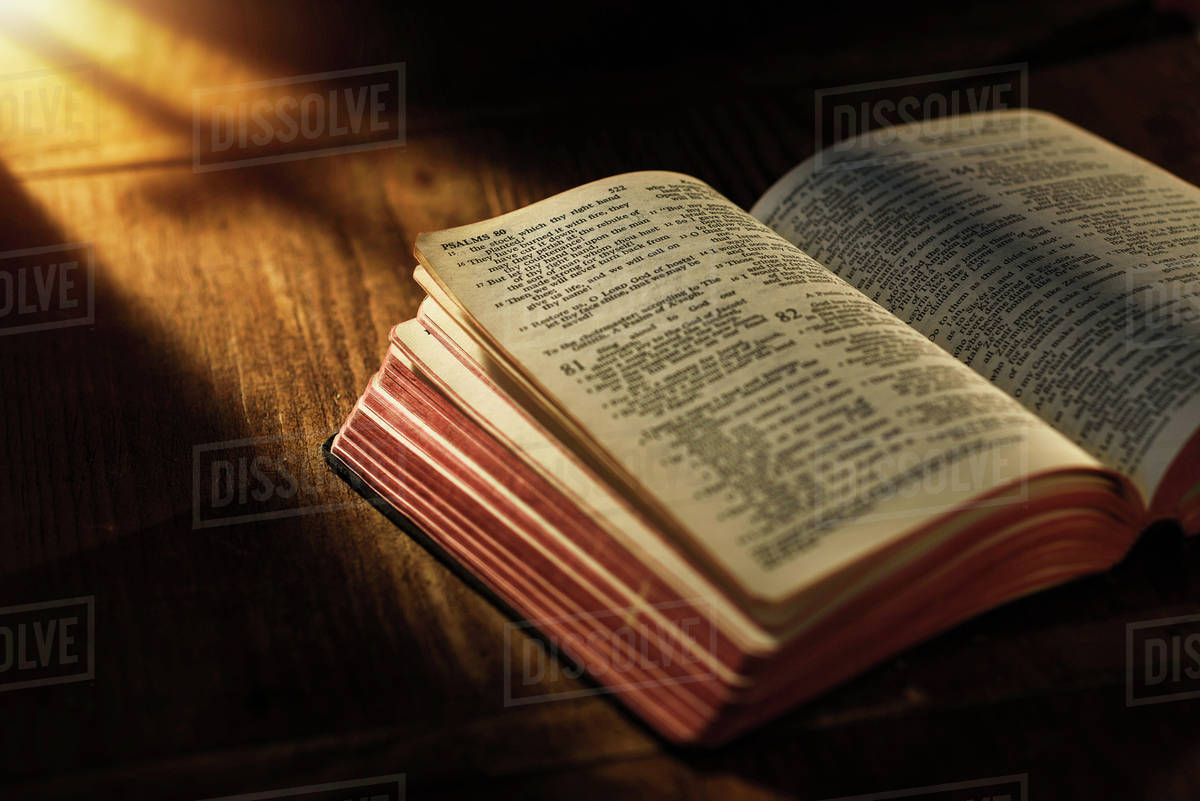 Up Of Open Bible On Table Stock Photo Dissolve Up Of Open Bible On Table Stock Photo Dissolve