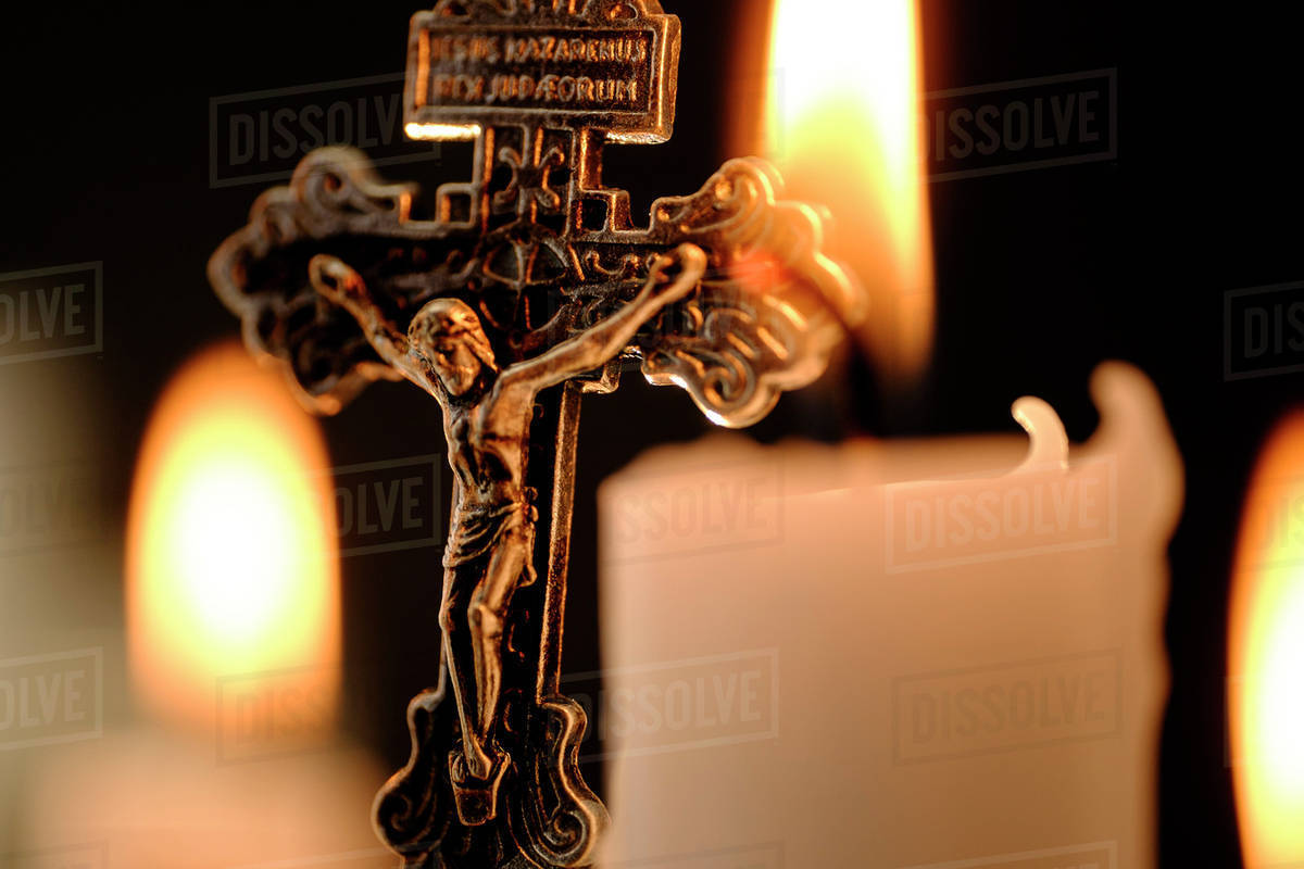 Burning candles and cross Stock Photo Dissolve