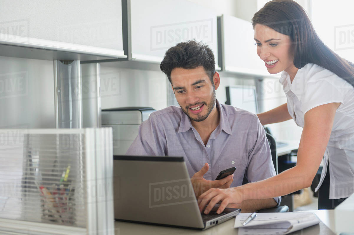 Business man and woman at work in office - Stock Photo - Dissolve