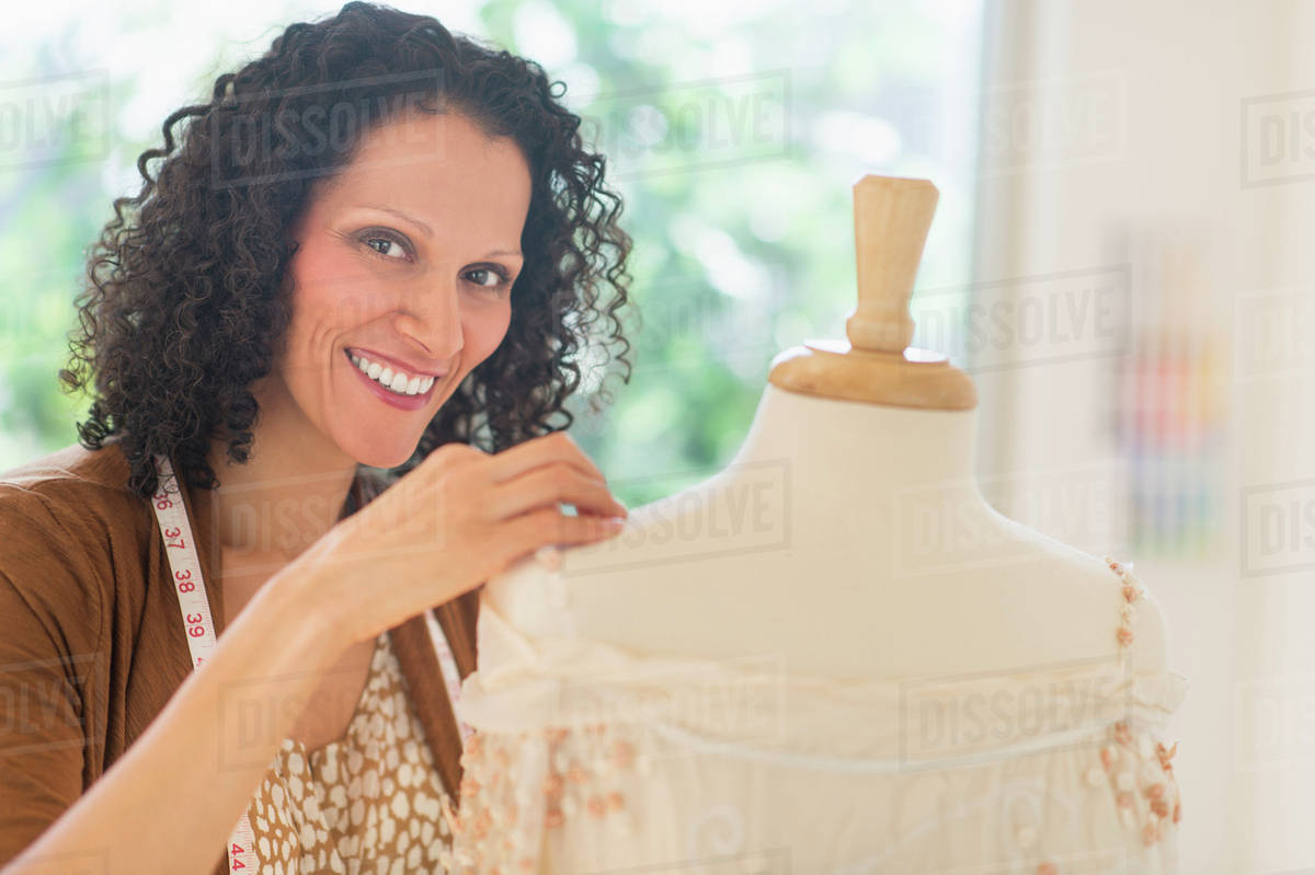 Portrait of clothes designer during work Stock Photo Dissolve