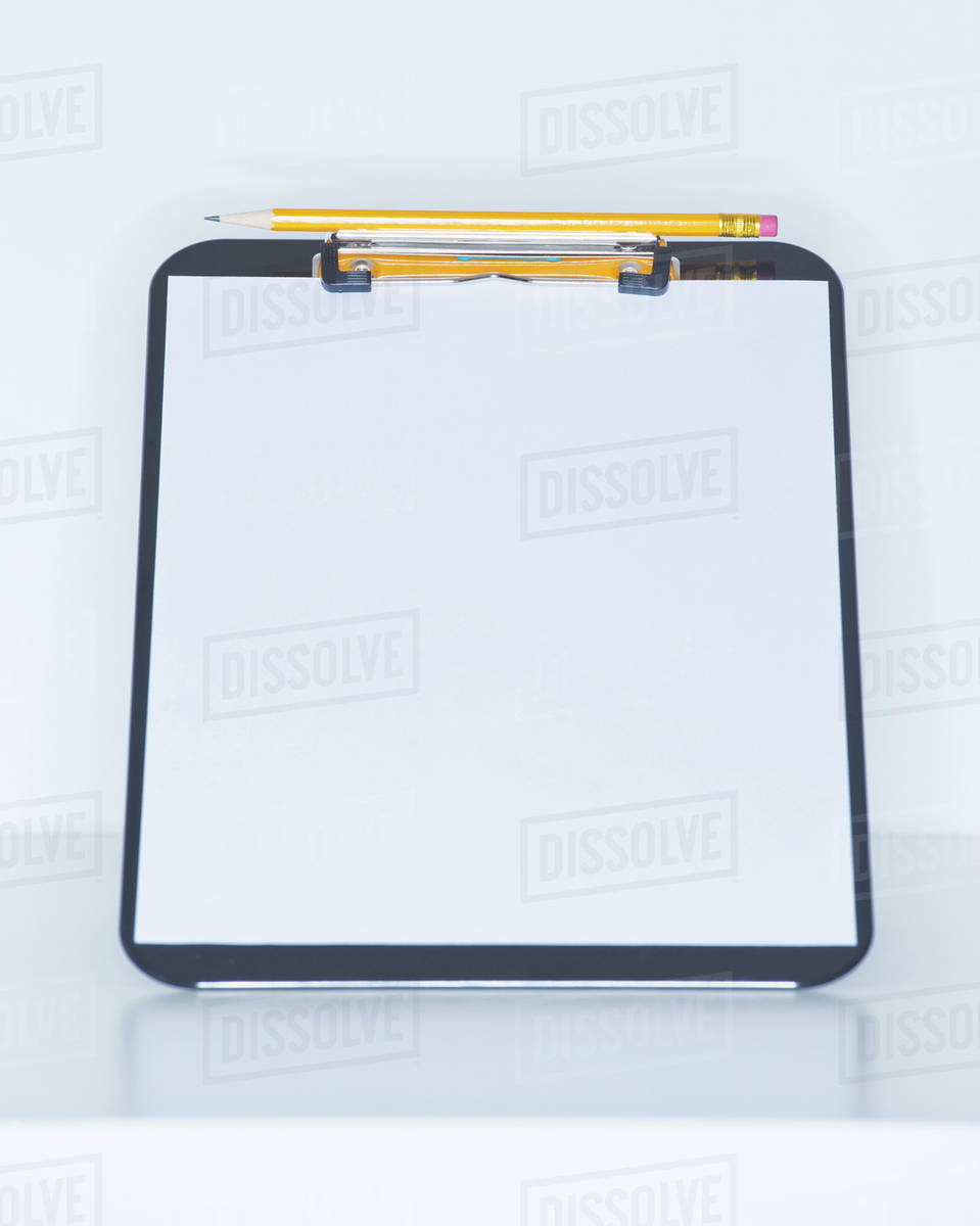 Studio shot of clear clipboard Stock Photo Dissolve