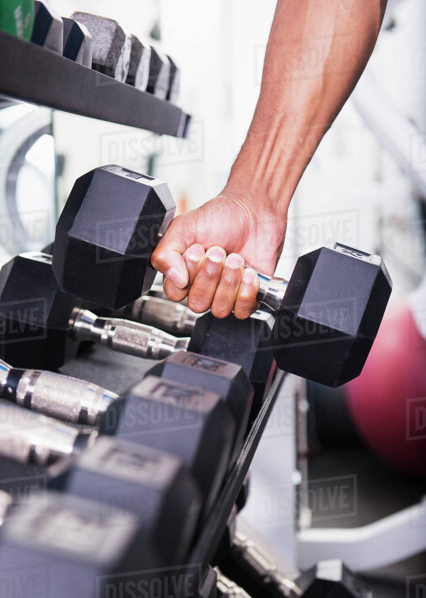 Dumbbells in gym Stock Photo Dissolve