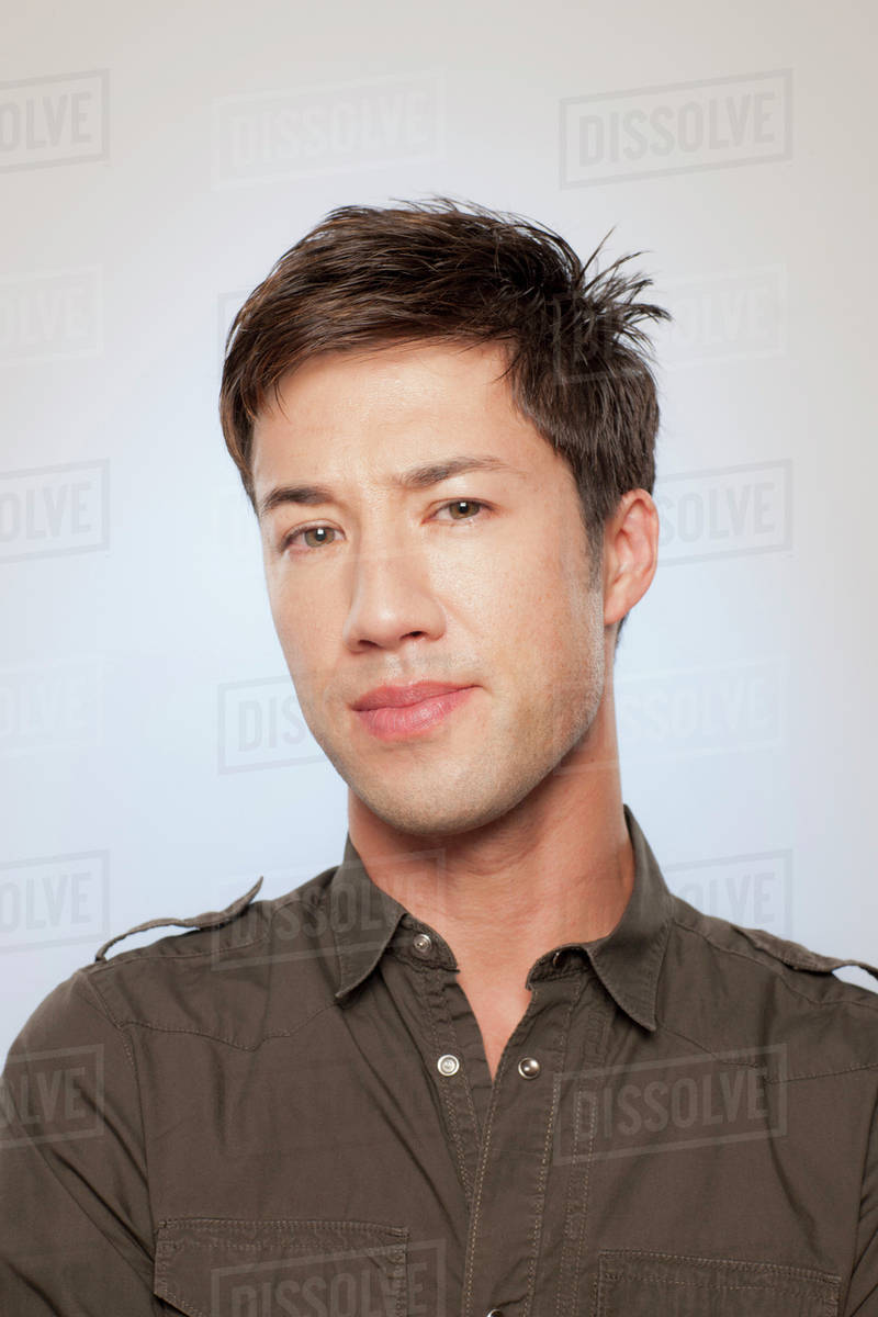 Portrait of man looking confused - Stock Photo - Dissolve
