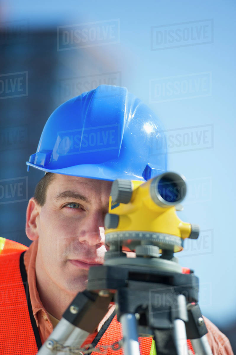 USA, New Jersey, Jersey City, construction worker in hard hat using