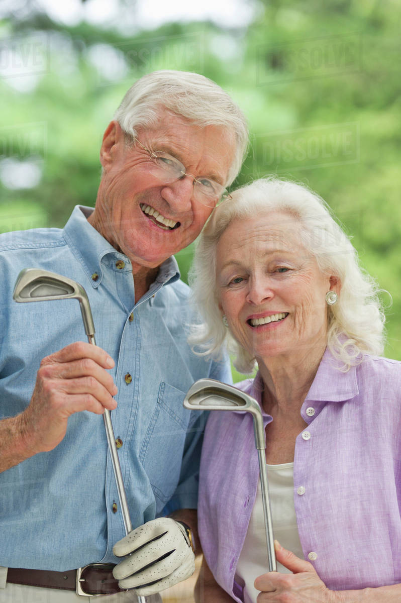 Senior couple playing golf Stock Photo Dissolve