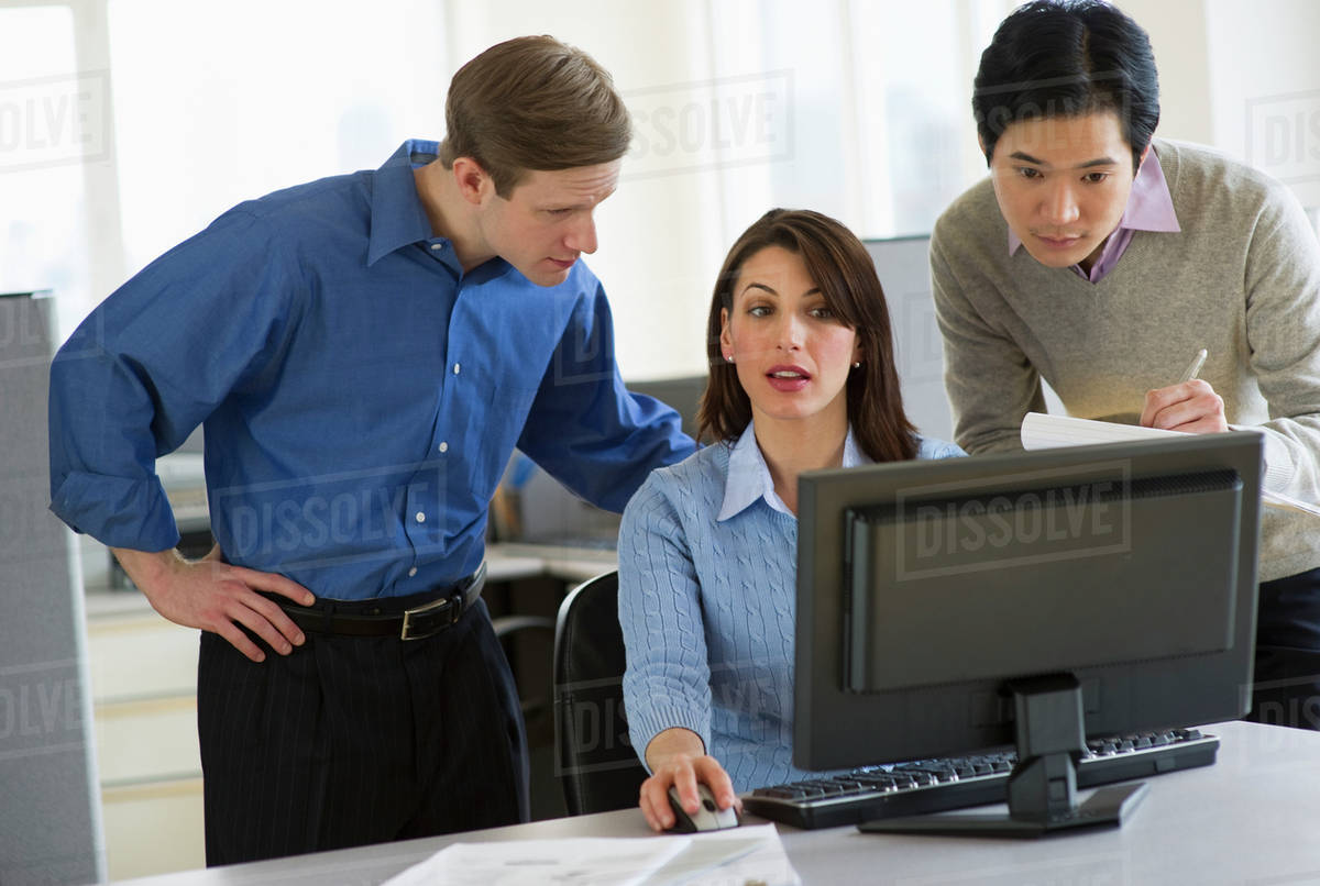 Office workers in cubicle Stock Photo Dissolve