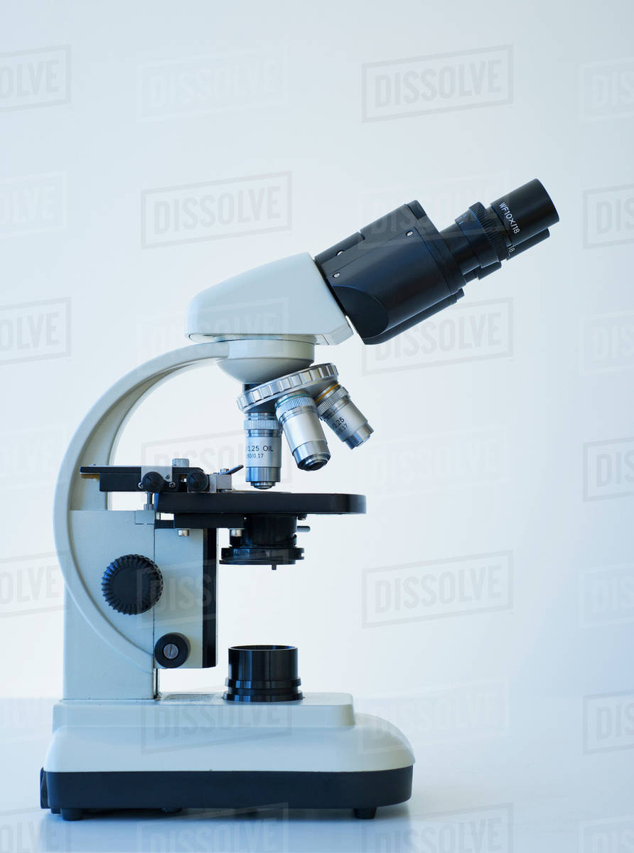 Microscope on white background - Stock Photo - Dissolve