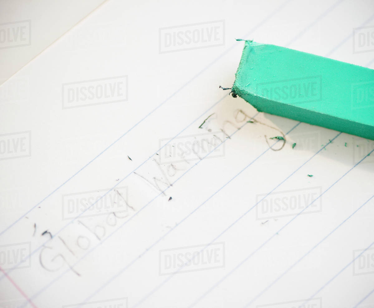 Eraser on notebook Stock Photo Dissolve