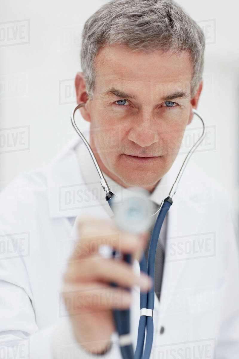 Doctor using stethoscope Stock Photo Dissolve