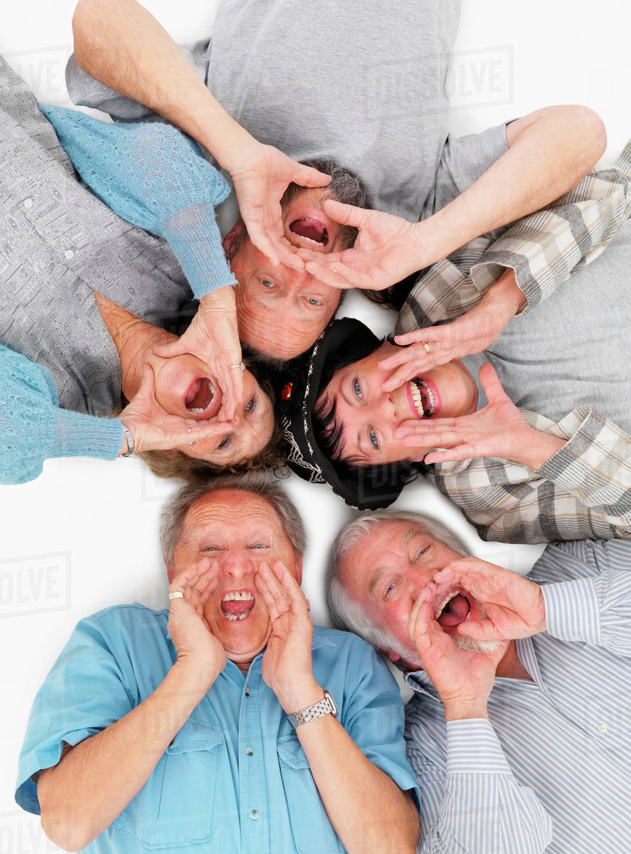 Five People Lying On The Floor And Yelling Stock Photo Dissolve