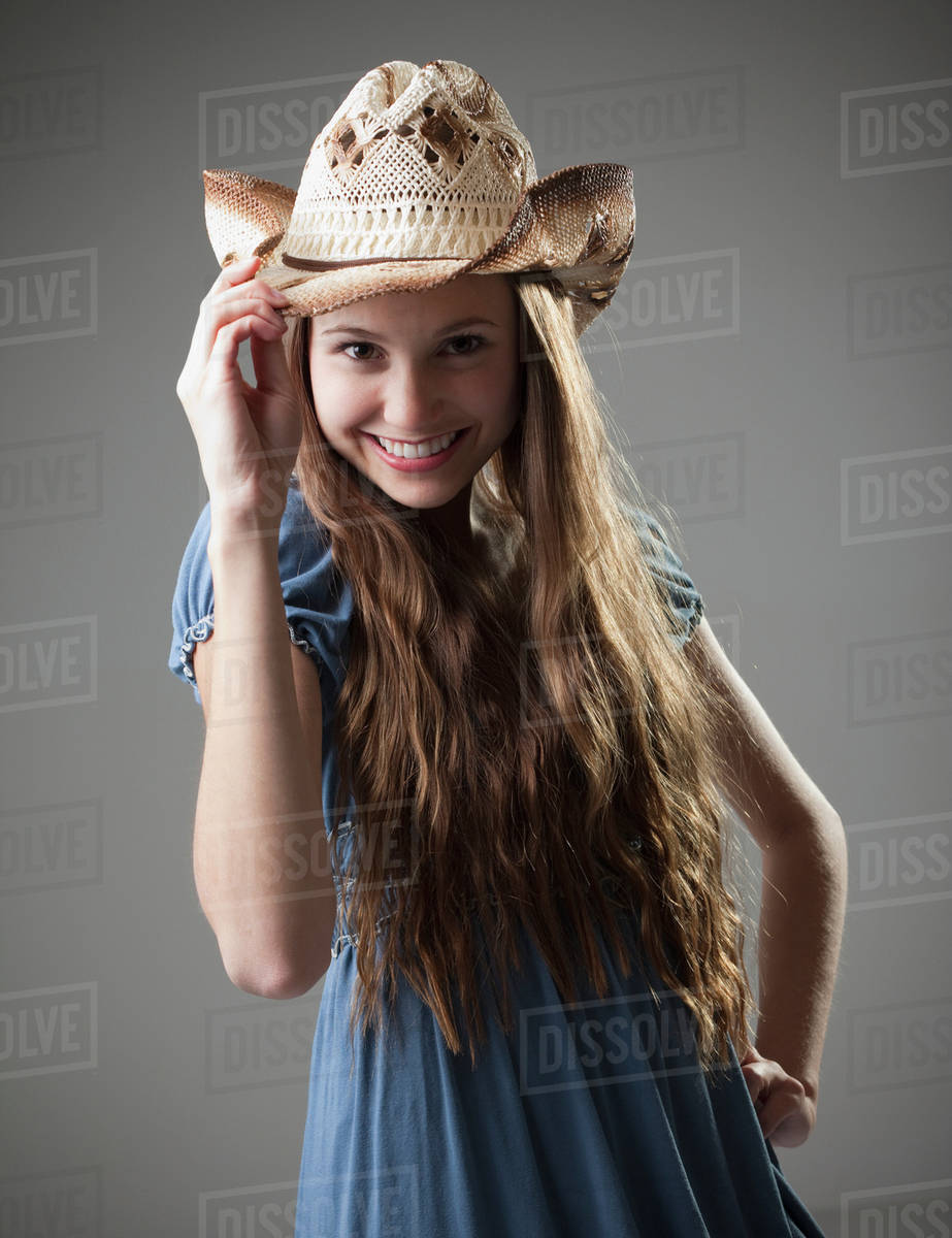 Beautiful Long Haired Cowgirl Tipping Her Hat Stock Photo Dissolve