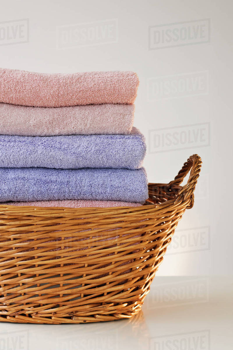 A laundry basket full of towels Stock Photo Dissolve