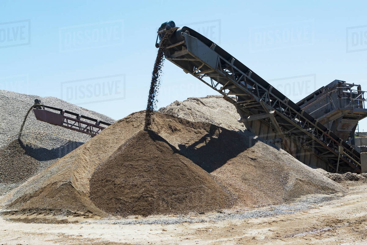 Conveyor belts moving gravel Stock Photo Dissolve