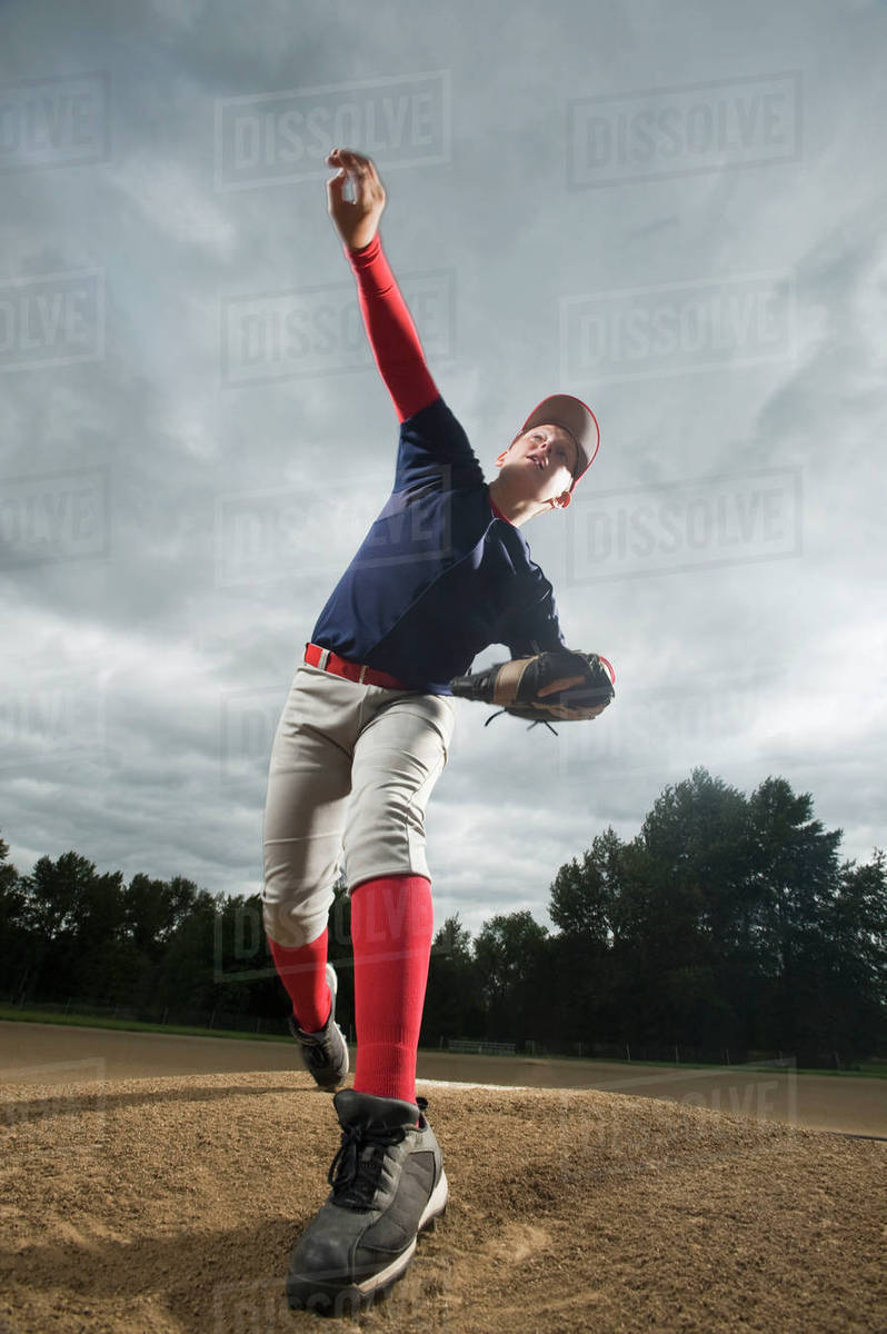 Baseball pitcher throwing ball Stock Photo Dissolve