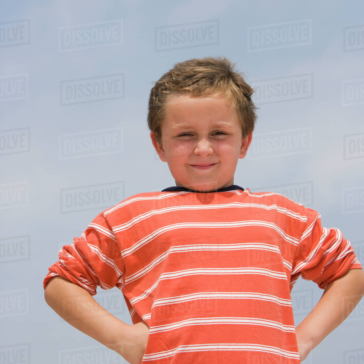 Boy with hands on hips Stock Photo Dissolve
