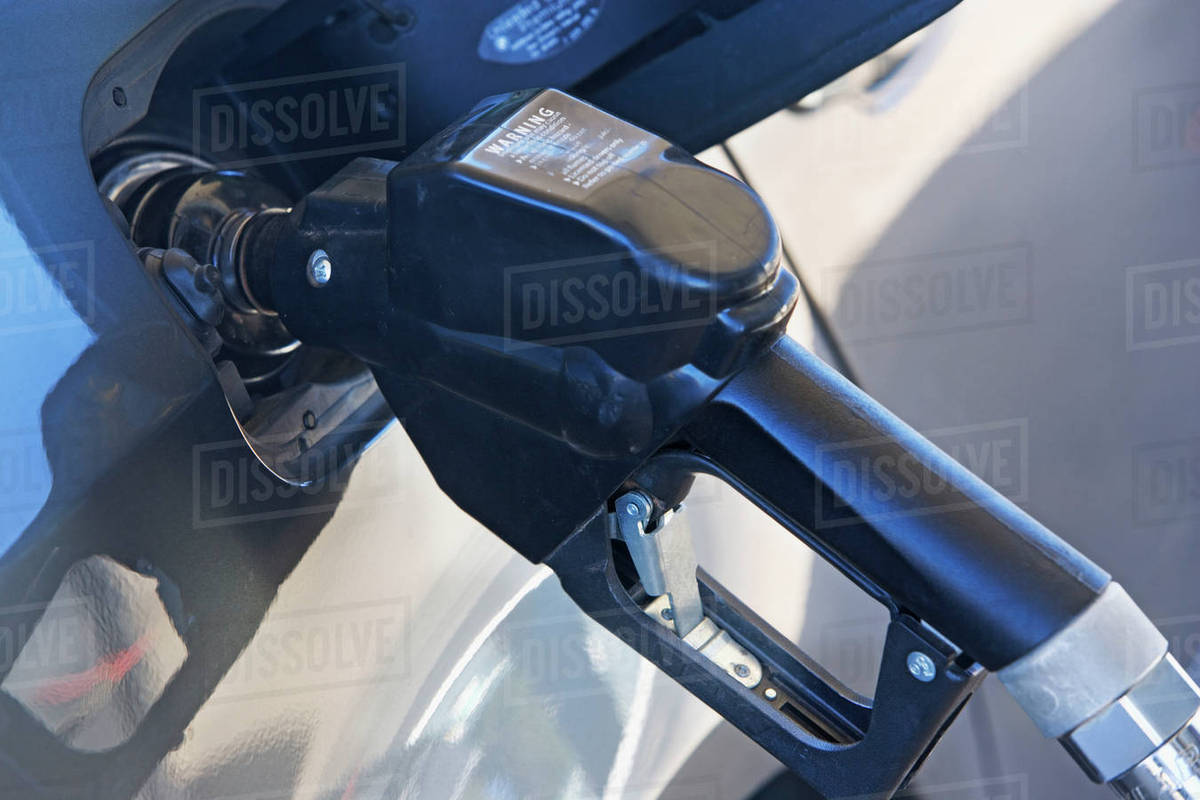 Pumping gas in a car Stock Photo Dissolve