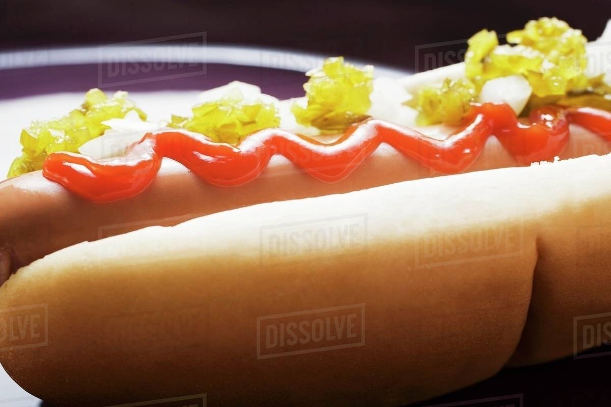 Hot dog with relish, ketchup and onions Stock Photo Dissolve