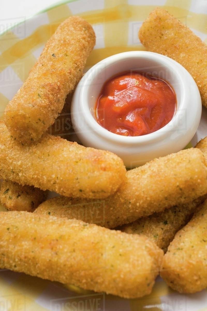 Mozzarella sticks with marinara sauce Stock Photo Dissolve