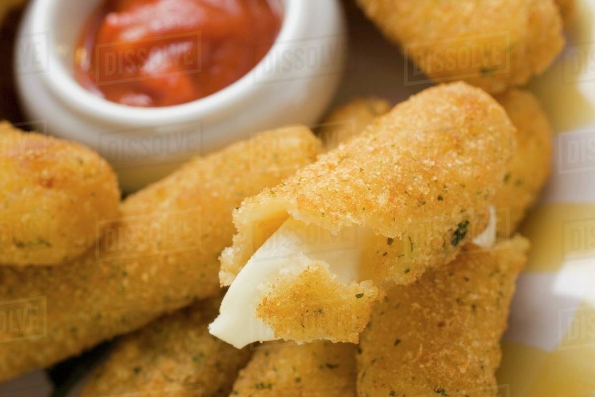 Mozzarella sticks with marinara sauce Stock Photo Dissolve