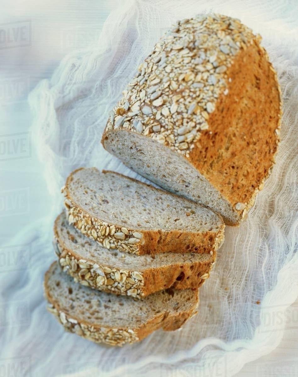 Wholemeal bread, sliced Stock Photo Dissolve