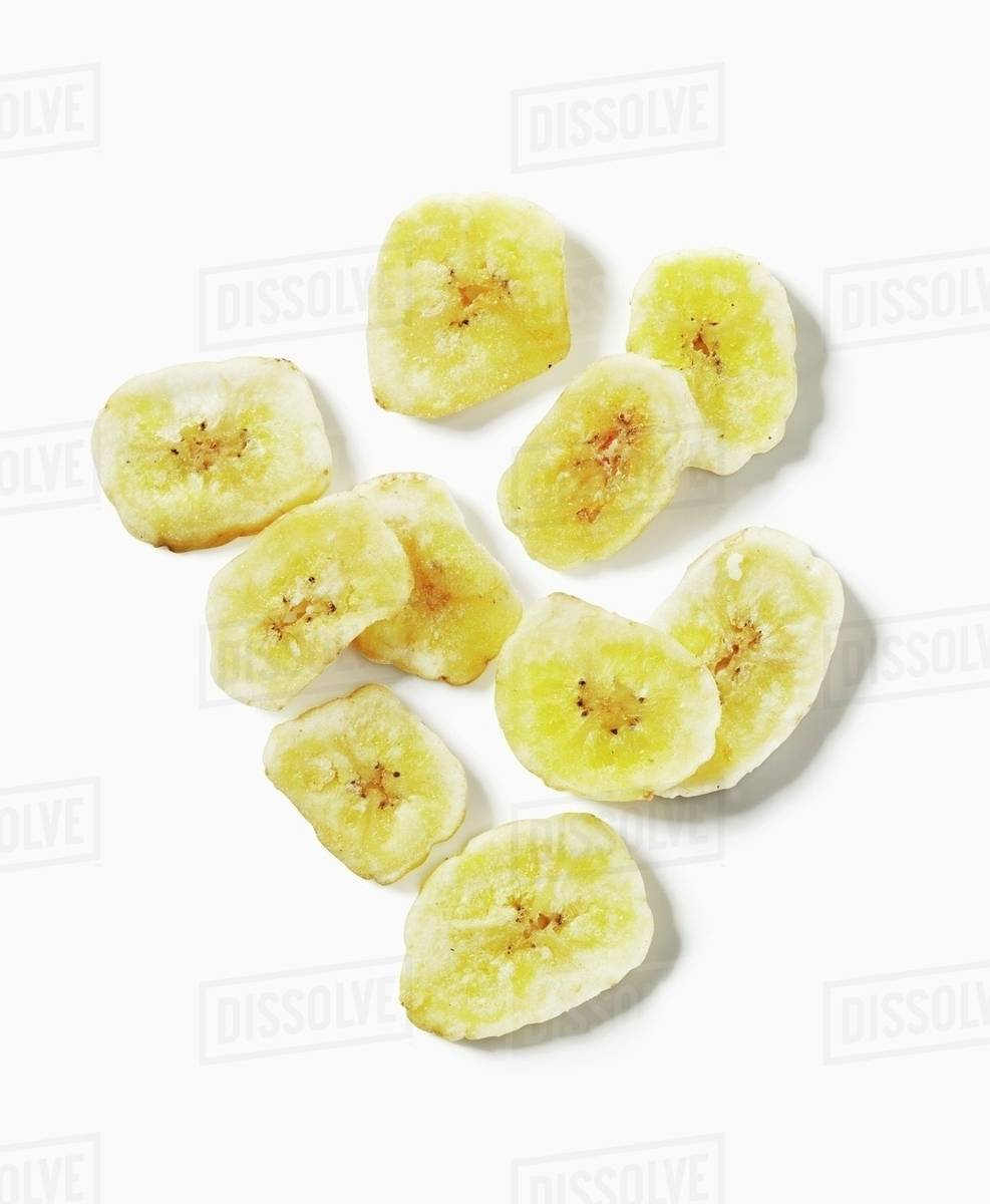 Dried banana slices, seen from above Stock Photo Dissolve