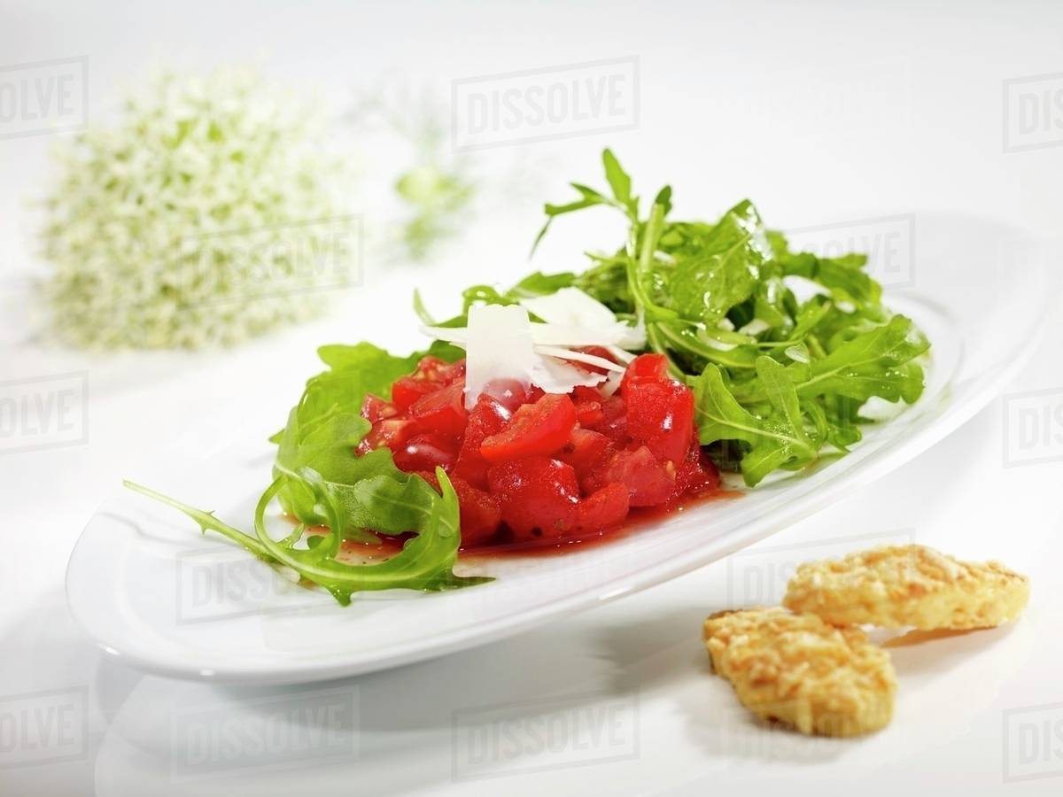 Rocket salad with tomatoes and rocket - Royalty-free Stock Photo | Dissolve