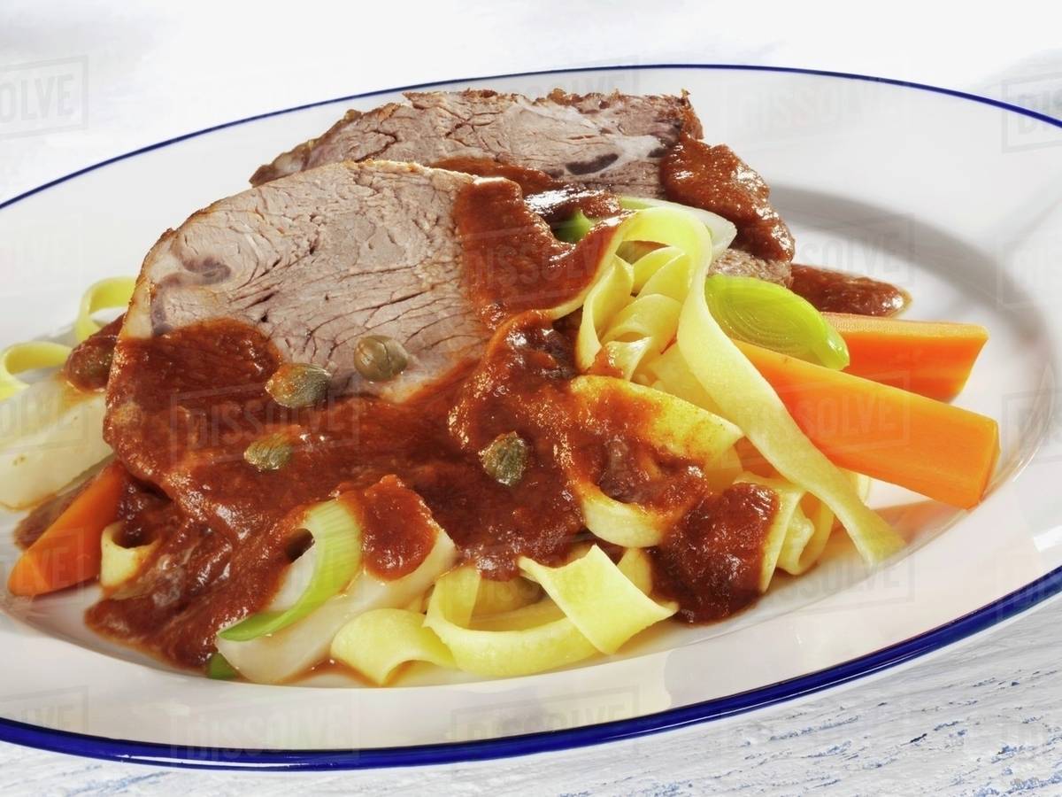 Pot roast beef with ribbon pasta and vegetables Stock Photo Dissolve