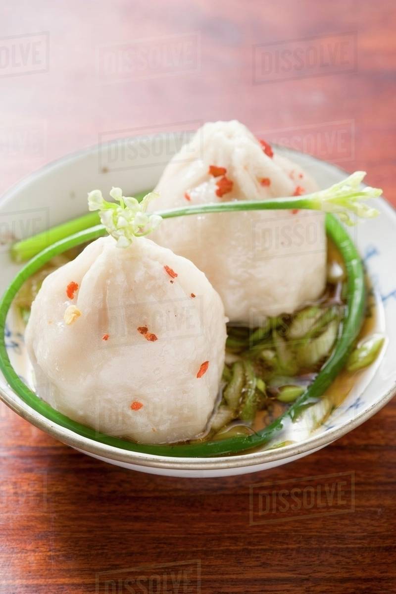 Dim sum in spicy sauce (Asia) Stock Photo Dissolve