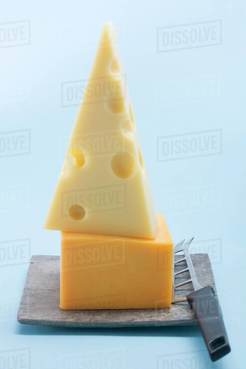 Emmental And Cheddar With Cheese Knife Stock Photo Dissolve