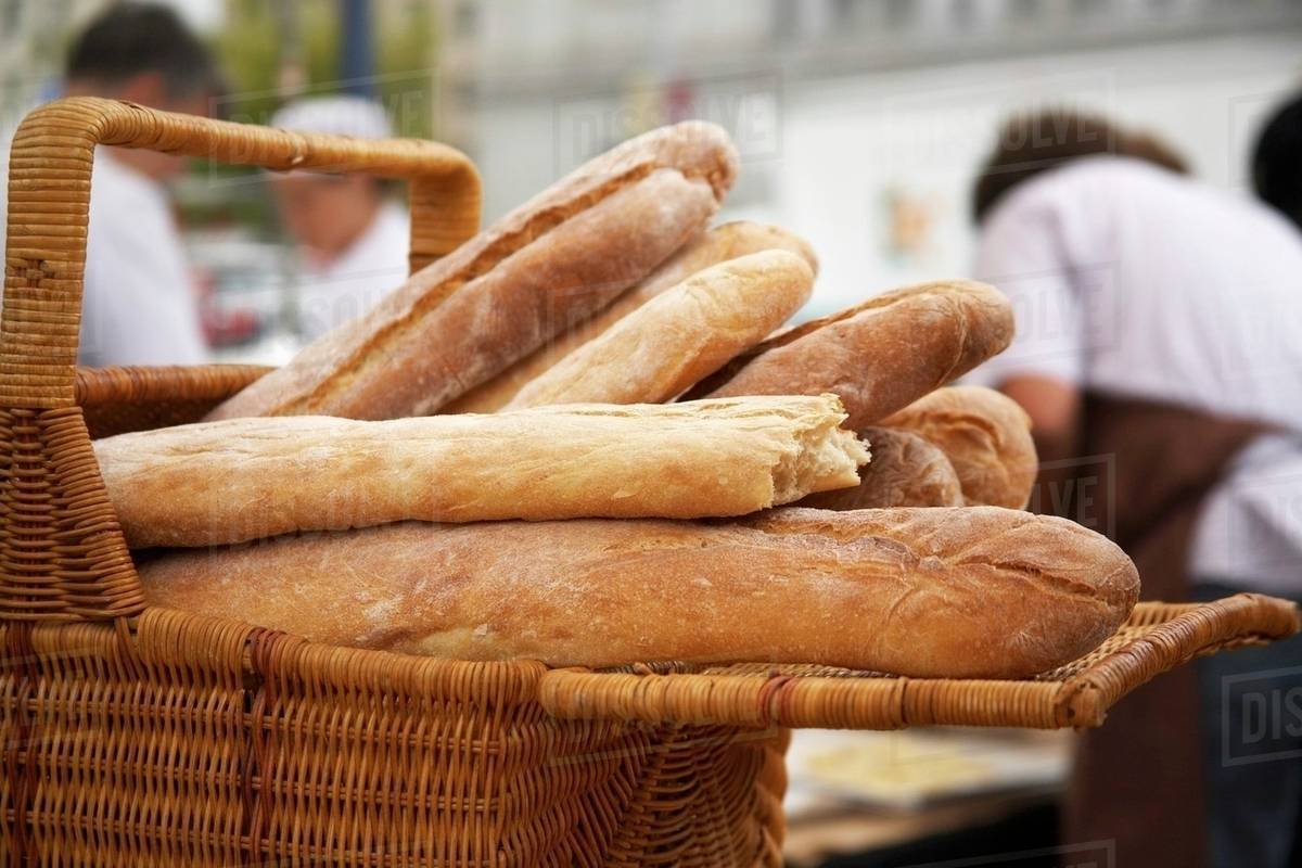 Basket of Artisan Bread at Market Stock Photo Dissolve